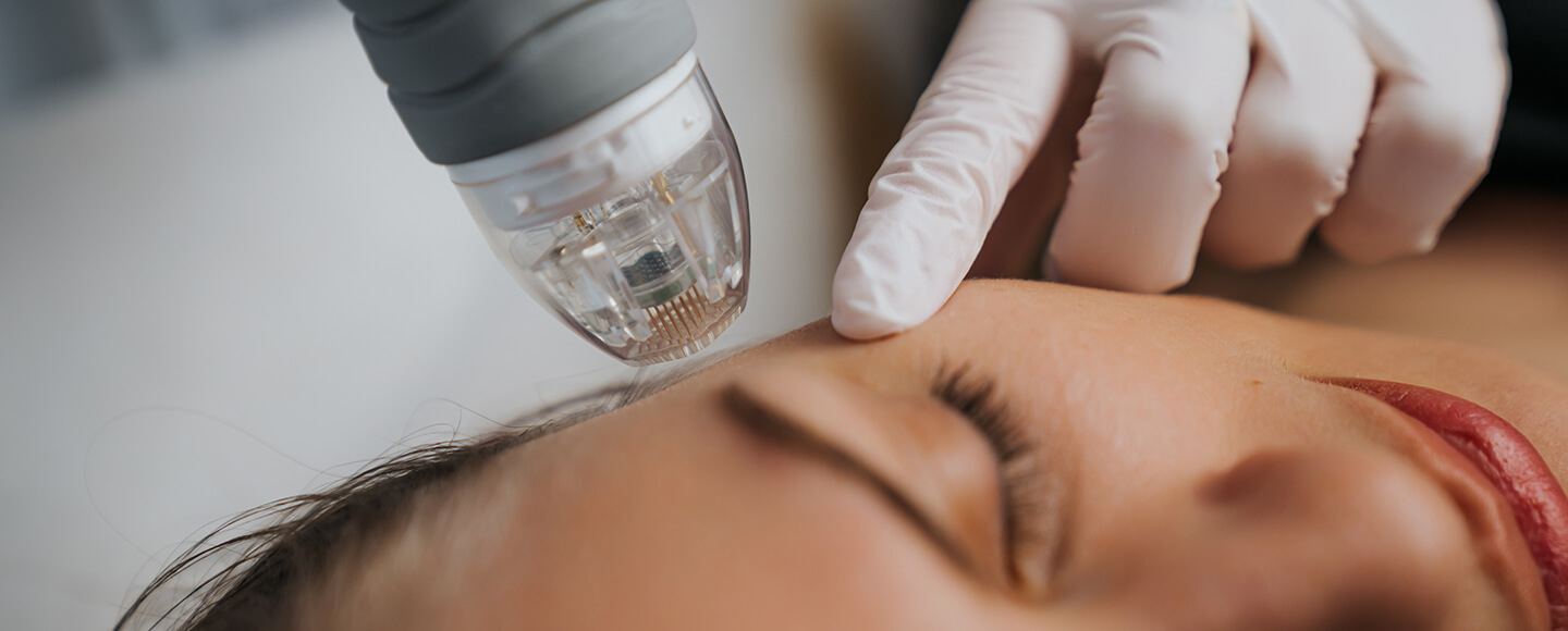Close-up of a woman receiving a facial tweakment, supporting a guide on how to age well as a woman
